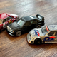 A photo of Hot Wheels diecasts. From left to right: Mercedes-Benz 300 SEL 6.8 AMG, 190E 2.5-16 Evolution II and W202 C-Class DTM.
